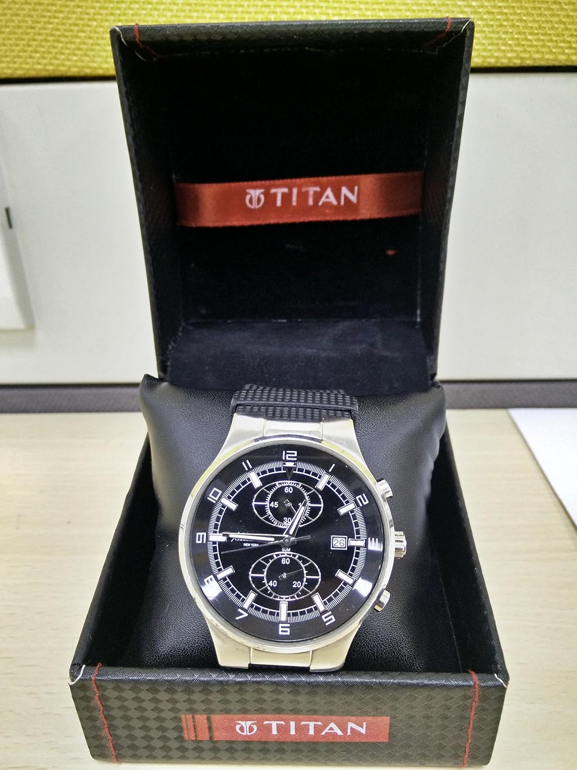 Kenneth Cole KC1315 watch inside a 'TITAN' branded watch box.