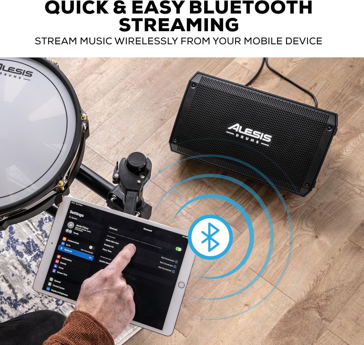 Alesis Strike Amp 8 MK2 with a tablet showing Bluetooth settings