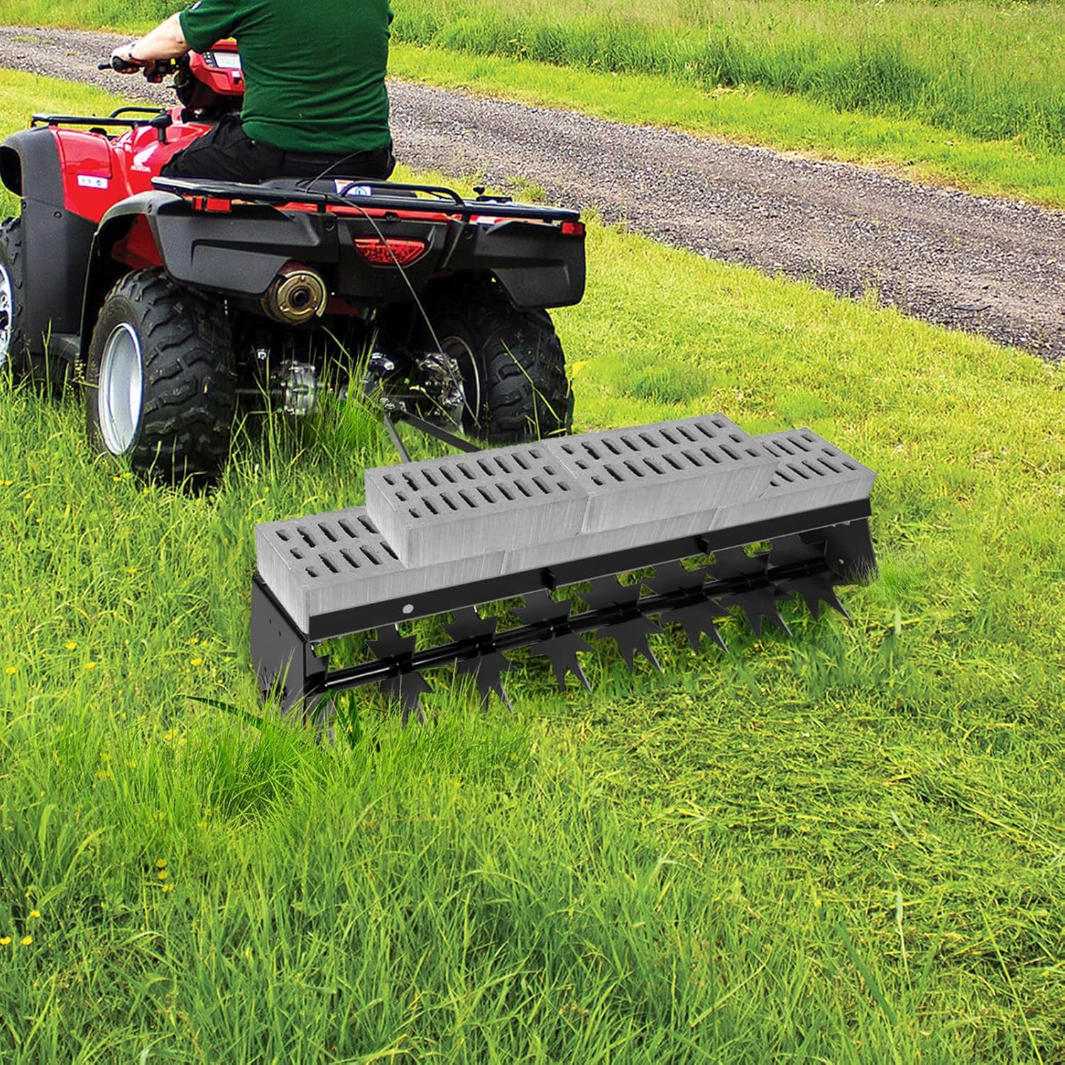 Tow Behind Spike Aerator attached to an ATV in a grassy field