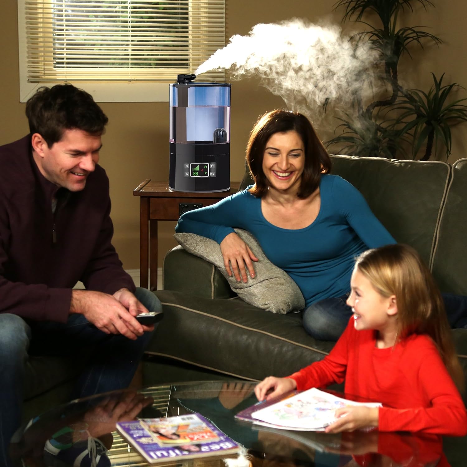 Family relaxing in a living room with the humidifier operating in the background