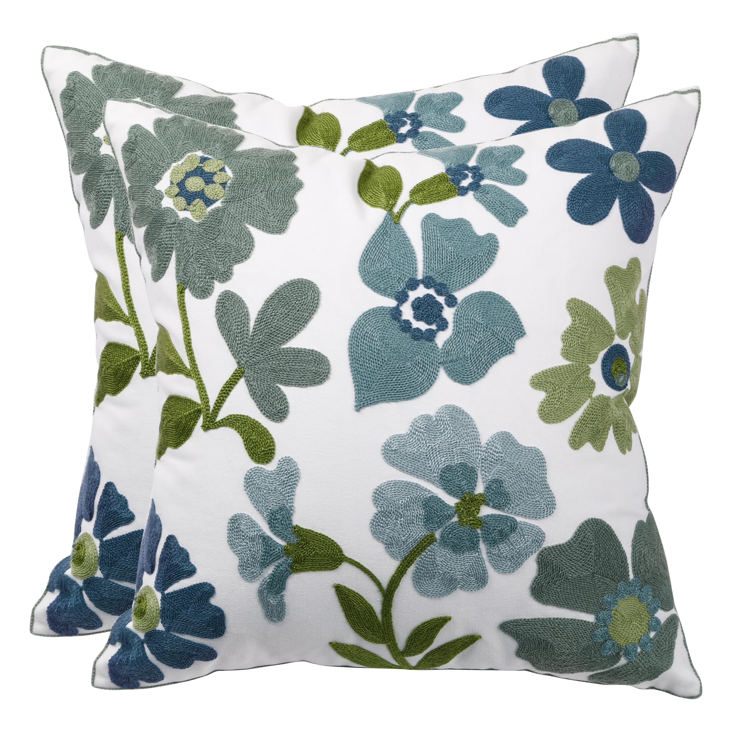 Housse de coussin fleurie bleue Tosleo, l'accessoire idéal pour un salon cocooning et chic.