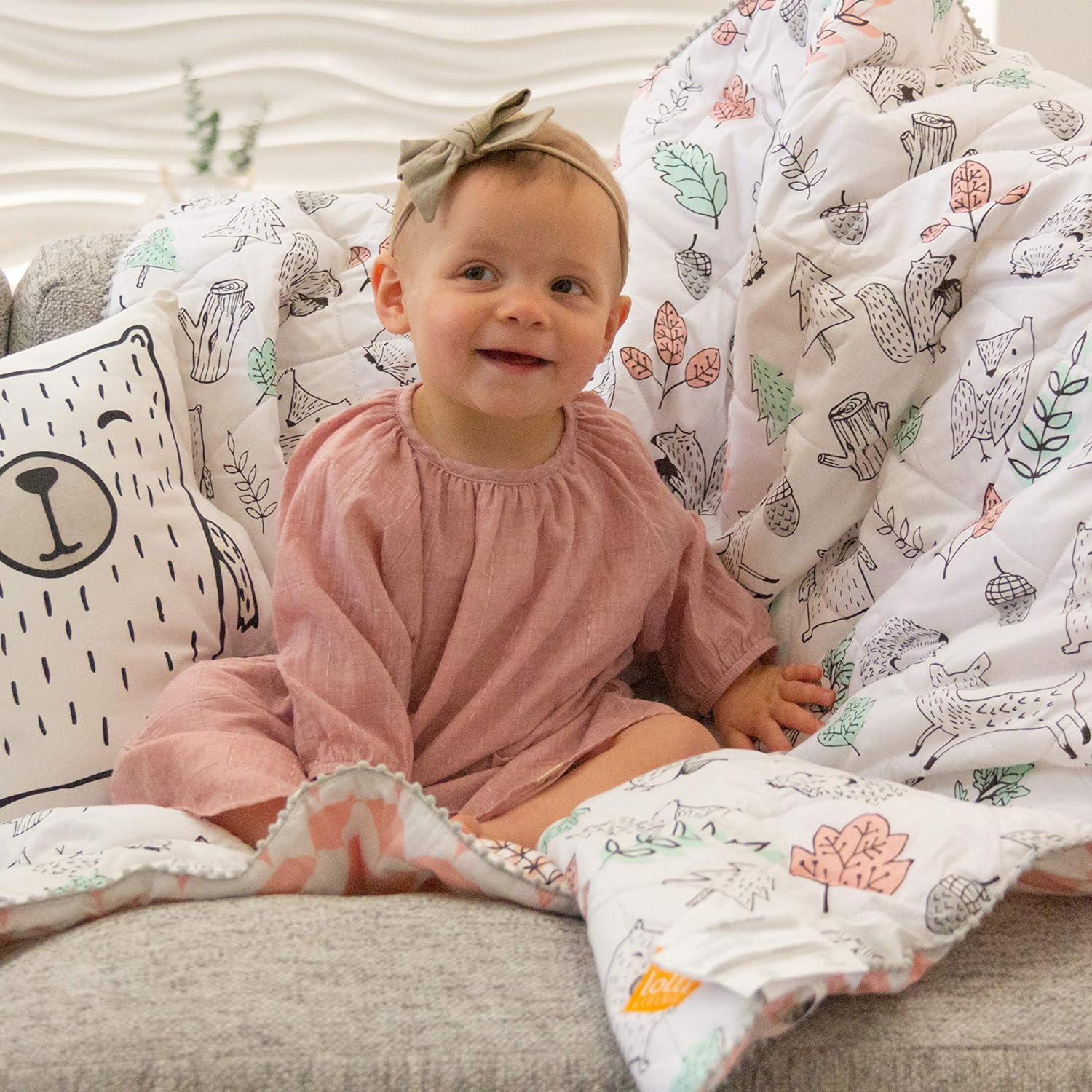 Lolli Living 4-Piece Baby Bedding Crib Set with Kayden Woodlands Pattern. Complete Set with Quilt, 2 Fitted Sheets, and Bed Skirt (Pink)