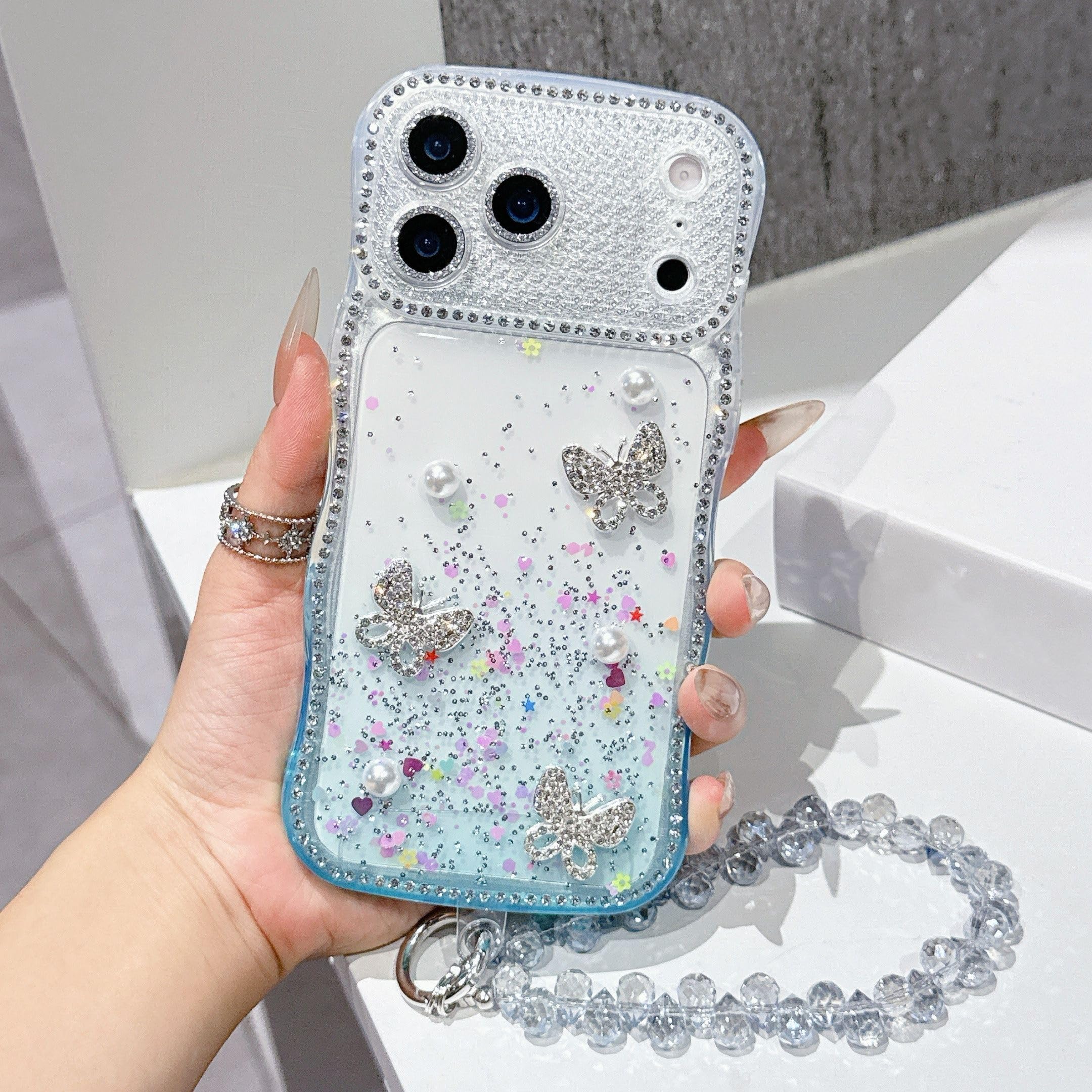 Funda para iPhone 17 16 15 14 13 Pro Max con brillo de diamantes de imitación, diseño degradado, correa para la muñeca, cordón y cubierta trasera a prueba de golpes (para iPhone 14 Pro/BL con cordón)