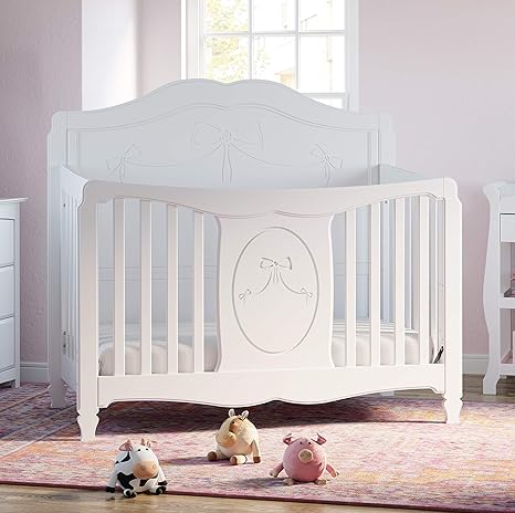 white crib with bow