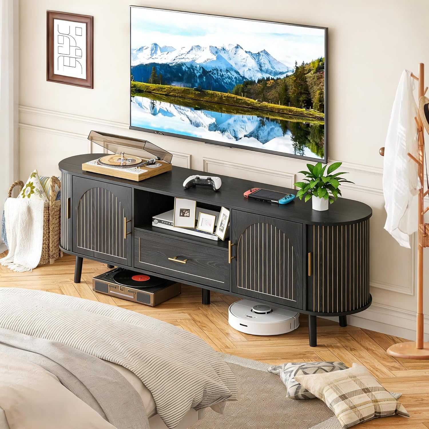Lifestyle image of the Mxtxmy 70-inch Fluted TV Stand in a living room setting with a TV and various media devices.