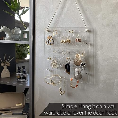 Miniatura 3 de JEREVER Soporte para aretes para colgar en la pared, organizador de joyas acrílico con 96 agujeros, 6 ganchos para collares, pulseras y otros