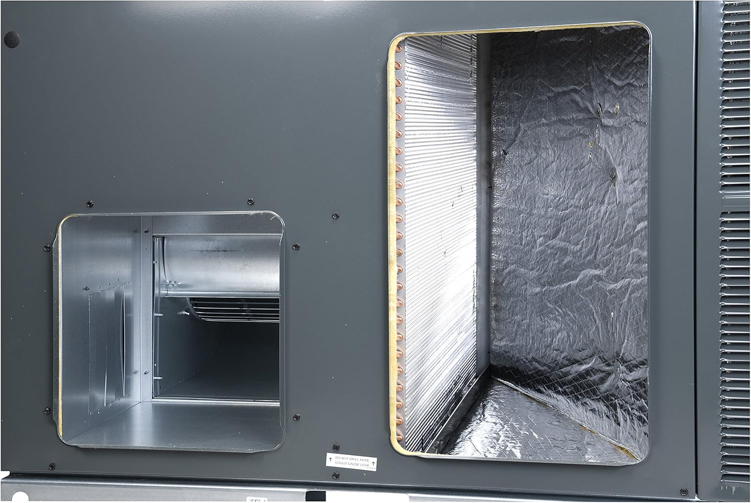 Internal view of Goodman AC unit showing duct connections