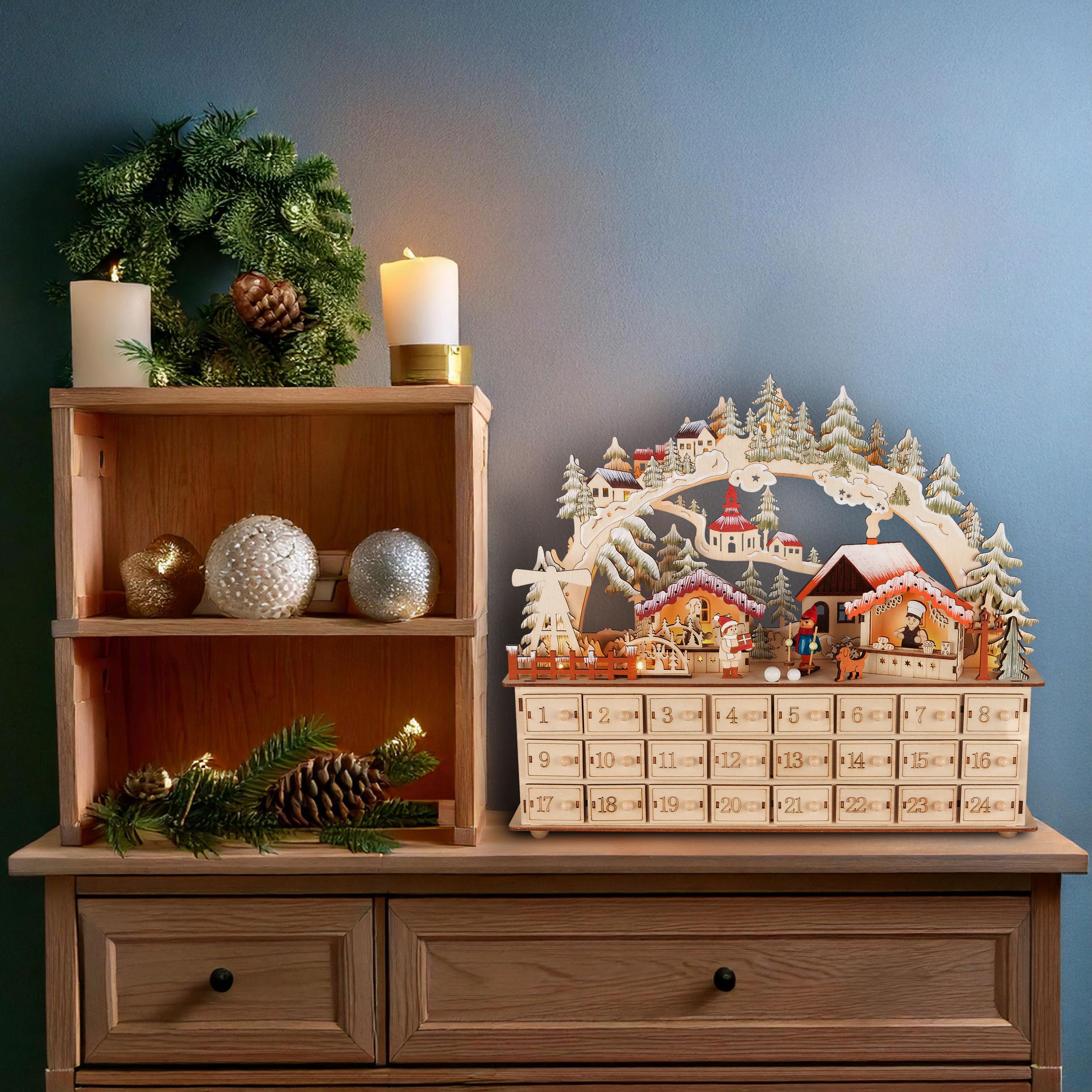 BRUBAKER Adventskalender zum Befüllen - Weihnachtsdorf 2026 | Holz Weihnachtskalender mit LED Beleuchtung - Dorf mit Kindern, Bäckerei, Hund & Wald - 40 cm Kalender mit Bogen - Beleuchtet
