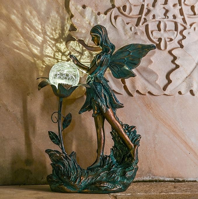 Made from high-quality, weather-resistant materials, this garden fairy statue is built to last and will add a touch of charm and whimsy to your outdoor space. Measuring at 10.6 x 8.5 x 4.5 inches, this graceful fairy statue is the perfect addition to any garden or outdoor area. Bring a touch of enchantment to your space with this exquisite garden fairy statue. Description by ChatGPT.