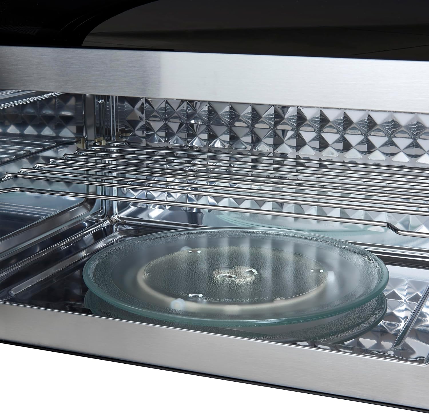 Close-up of the microwave interior showing the glass turntable and its support ring.