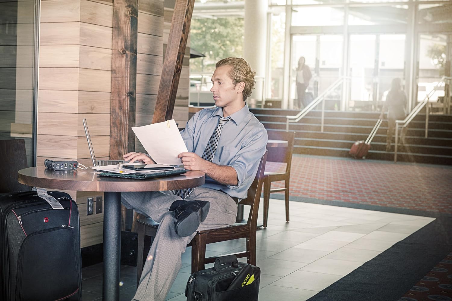 Person working on laptop with Goal Zero Sherpa 50 nearby
