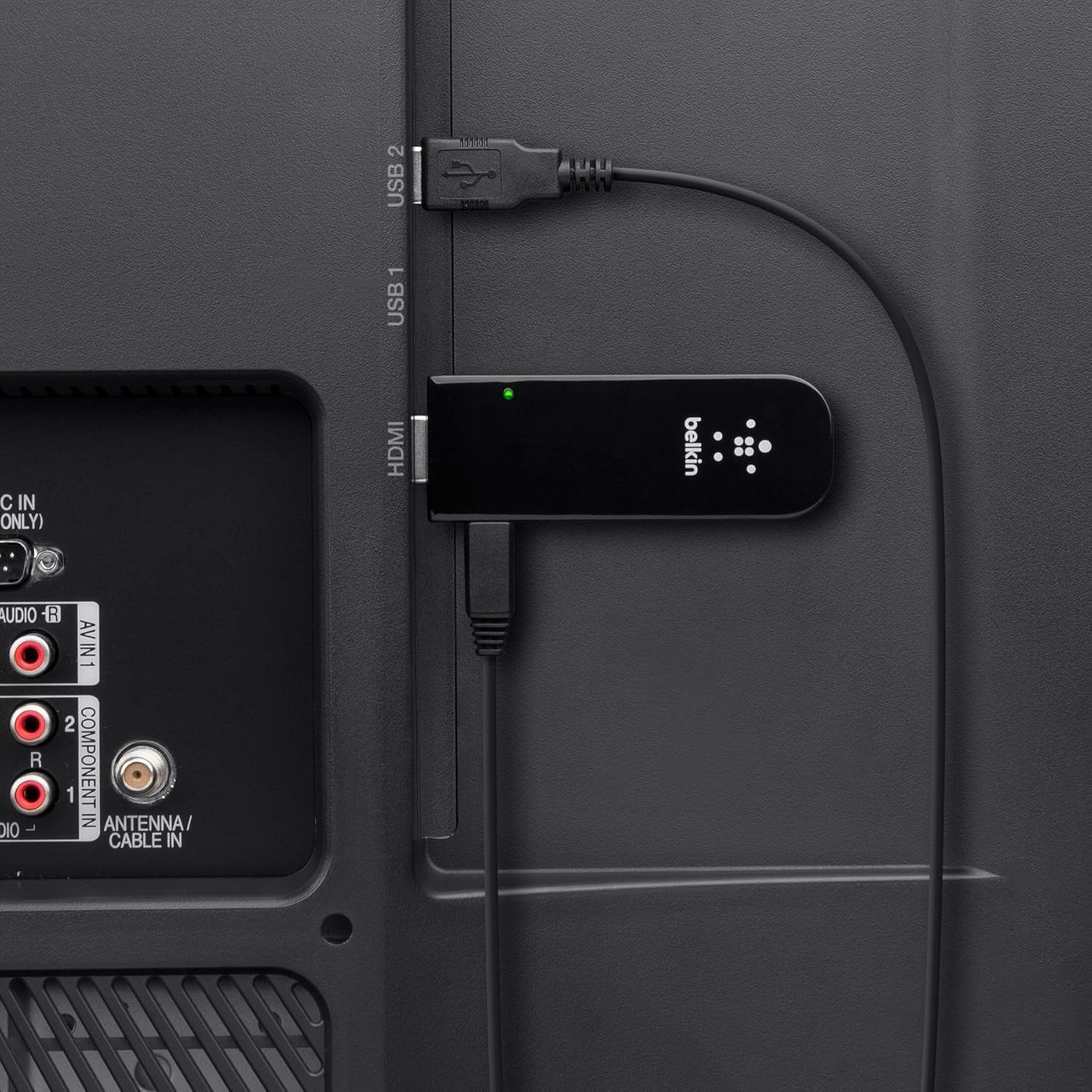 Belkin Miracast Video Adapter connected to an HDTV via HDMI and powered by USB.