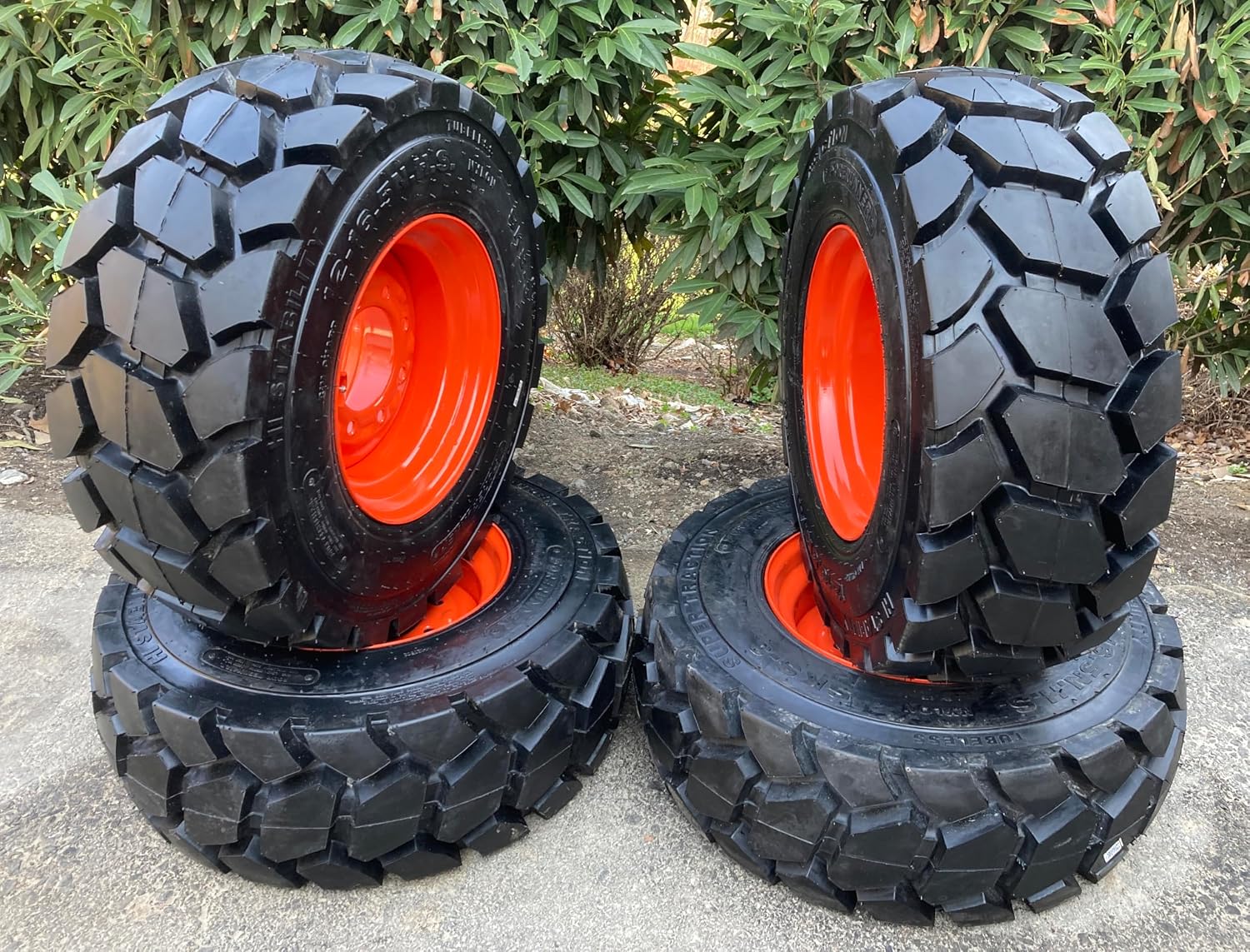 Set of 4-Heavy Duty 12-16.5 Forerunner SKS-3 non-directional Skid Steer Tires on Wheels/Rims (8 lug) for Bobcat -14PLY