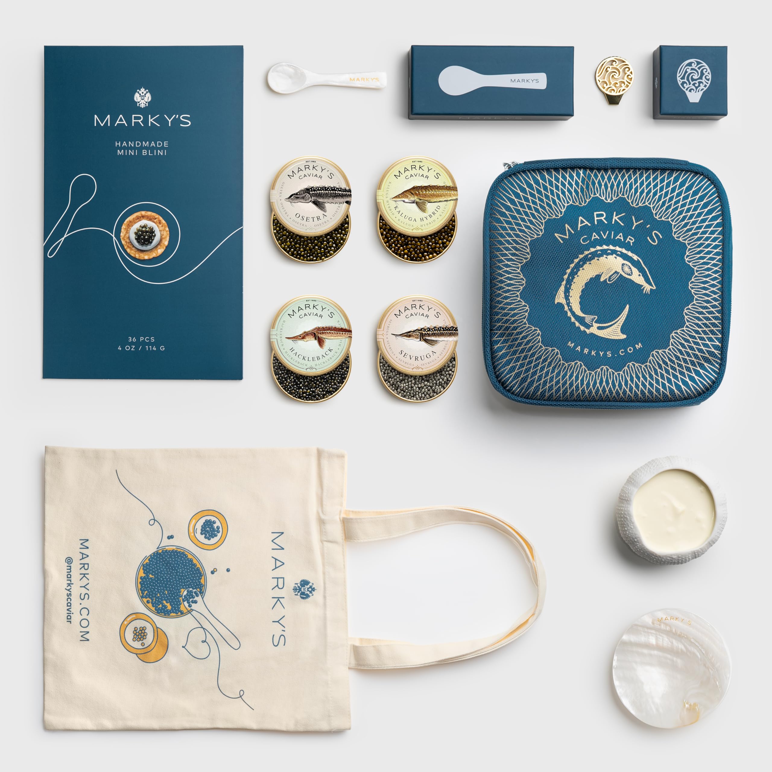MARKY'S Caspian Caviar Gift Set - 1 oz / 28 g (Pack of 4) x Kaluga Hybrid Caviar , Hackleback Caviar, Osetra Caviar, Sevruga Caviar - Caviar Blini - Caviar Serving Set - Mother of Pearl Spoon, Plate & Tin Opener - Comes with Cooler Gift Bag
