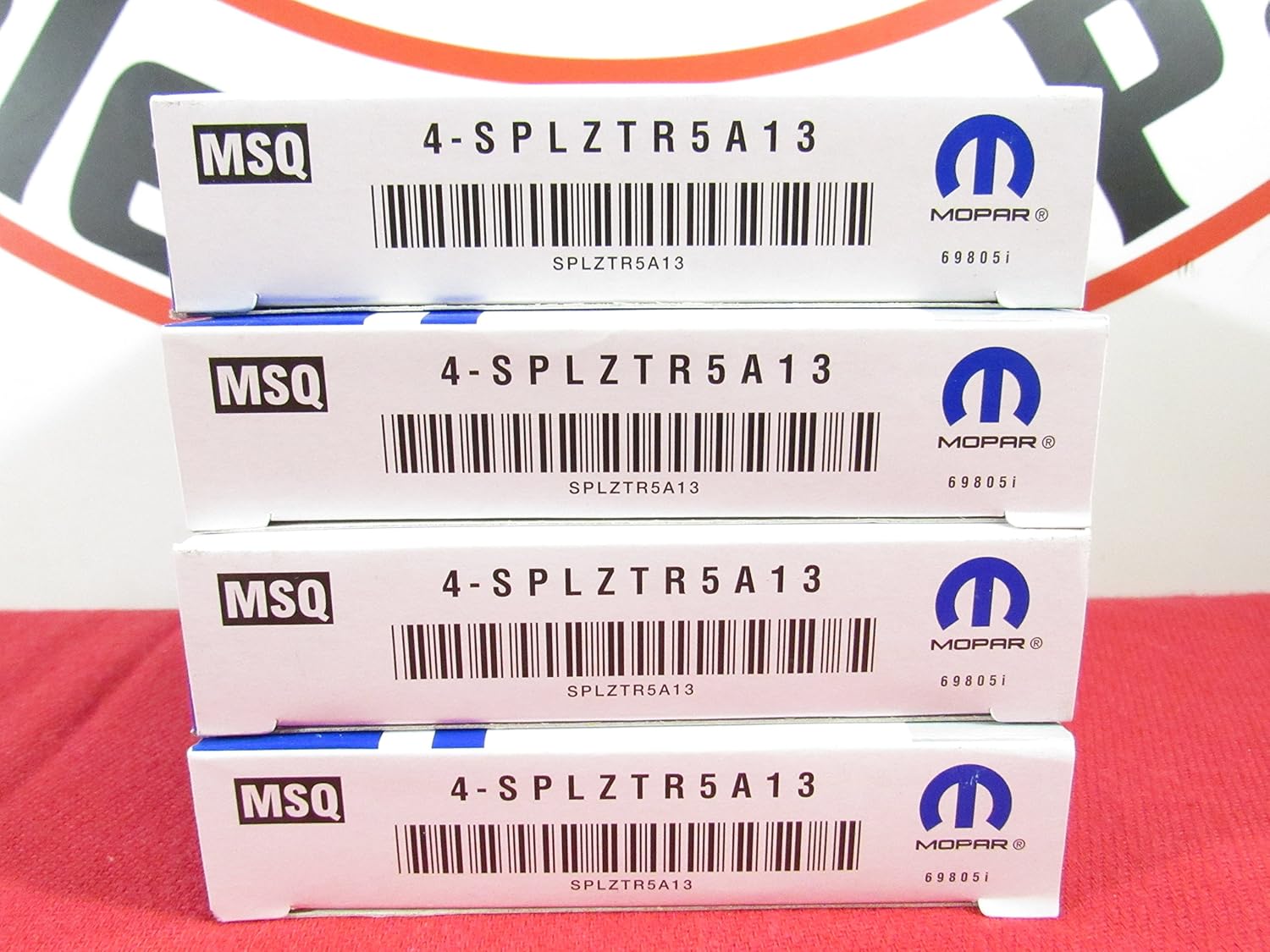 Four boxes of Mopar spark plugs, each labeled MSQ 4-SPLZTR5A13 and featuring the Mopar logo.