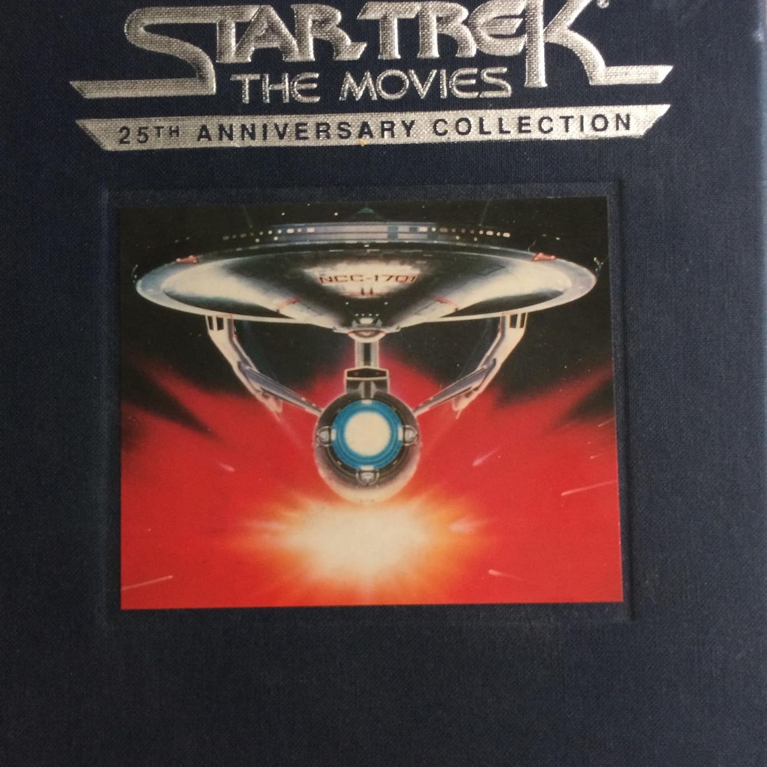 Star Trek. The Movies. 25th Anniversary Collection. 1991. 5 Videotapes in Cloth box with 5 VHS tapes in VHS boxes with pins. Includes Star Trek, The Motion Picture, The Wrath of Khan, The Search for Spock, The Voyage Home and The Final Frontier.