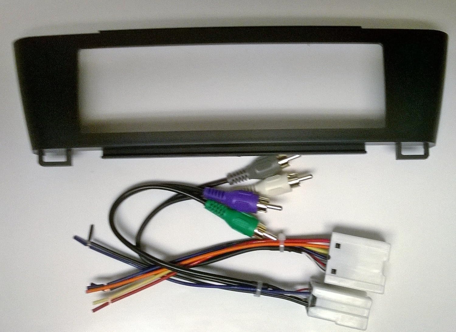 Stereo Dash Kit and Wire Harness for Installing a New Radio into a Nissan Sentra 2000-2006 (Factory Built in amp, Black with Smooth Gloss Texture)