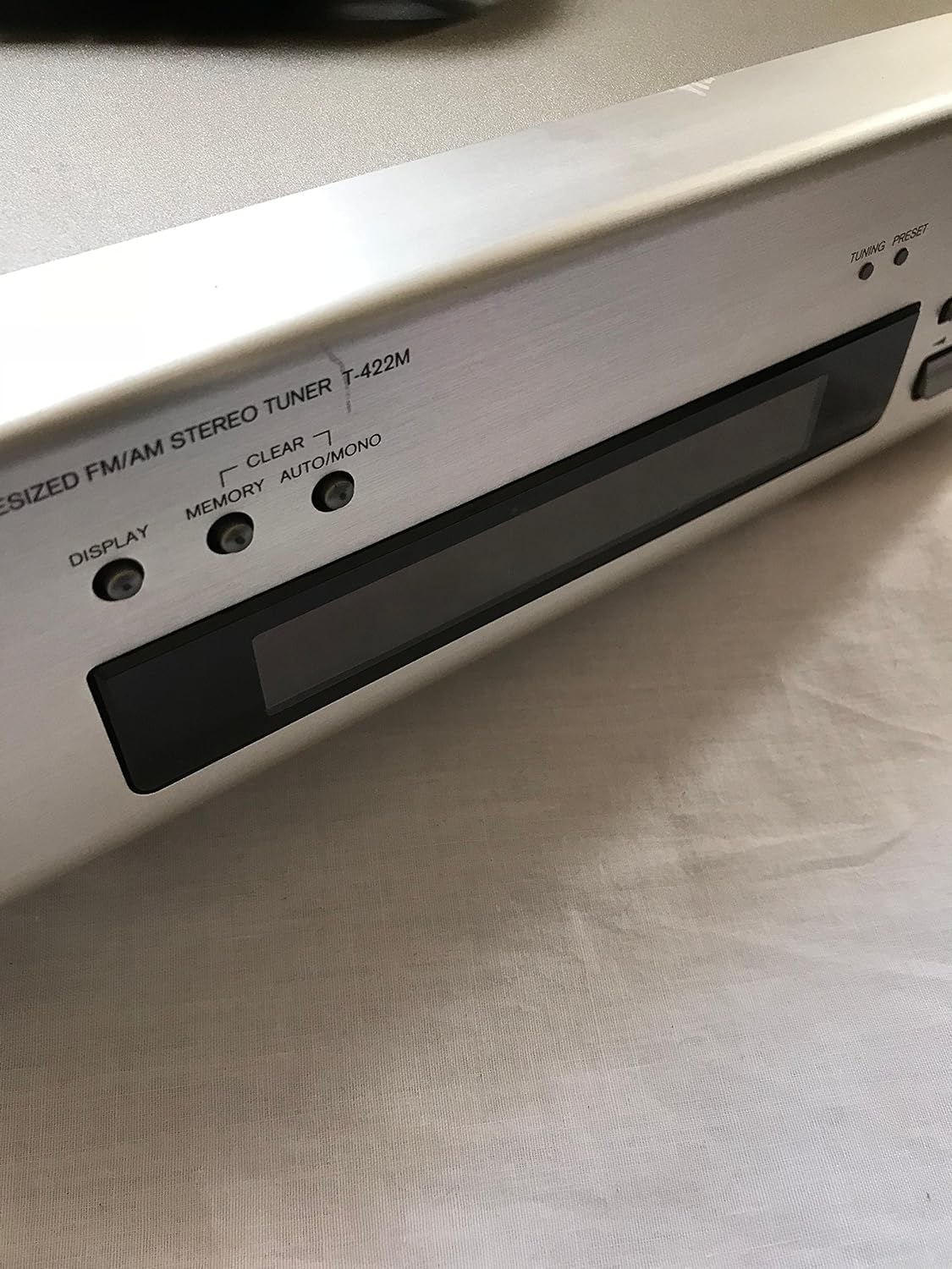 Close-up of the ONKYO T-422M(S) Tuner's front display and control buttons.