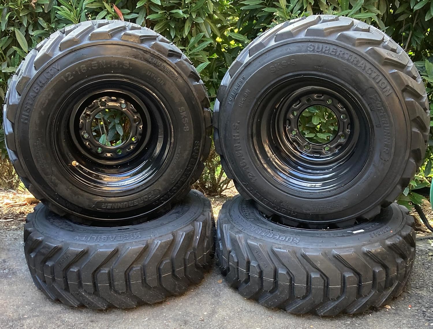 Set of 4-HD 12-16.5 Forerunner SKS-8 Skid Steer Tires on Black Wheels/Rims (8 lug) for Bobcat & more (6.5" Back Spacing) -14PLY -12X16.5