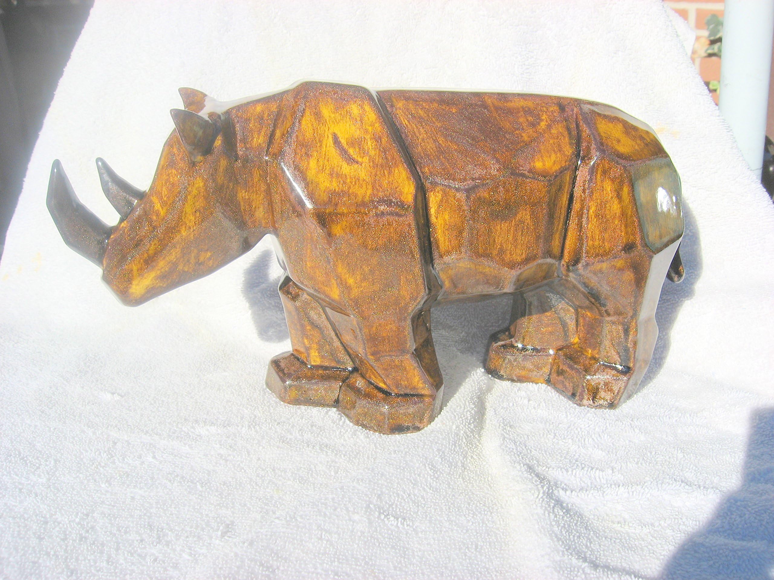 Rhinoceros statue. Ceramic with unique metallic copper finish.