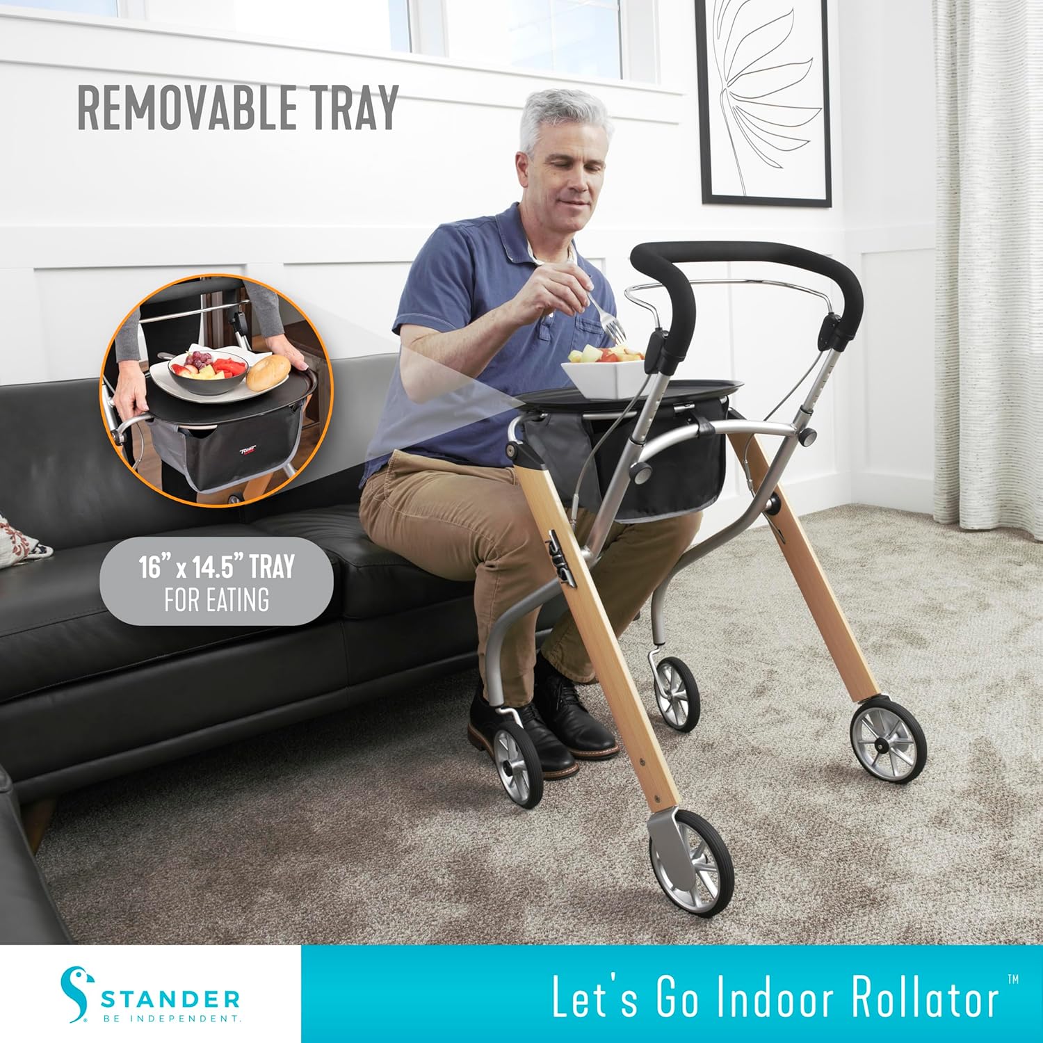 A person using the rollator with the removable tray to carry a bowl of fruit.