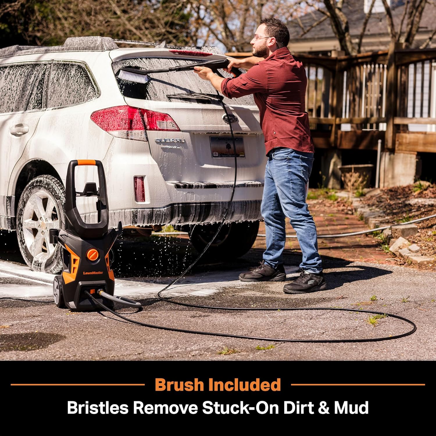 Man using the foam bottle accessory with the LawnMaster pressure washer to clean a car
