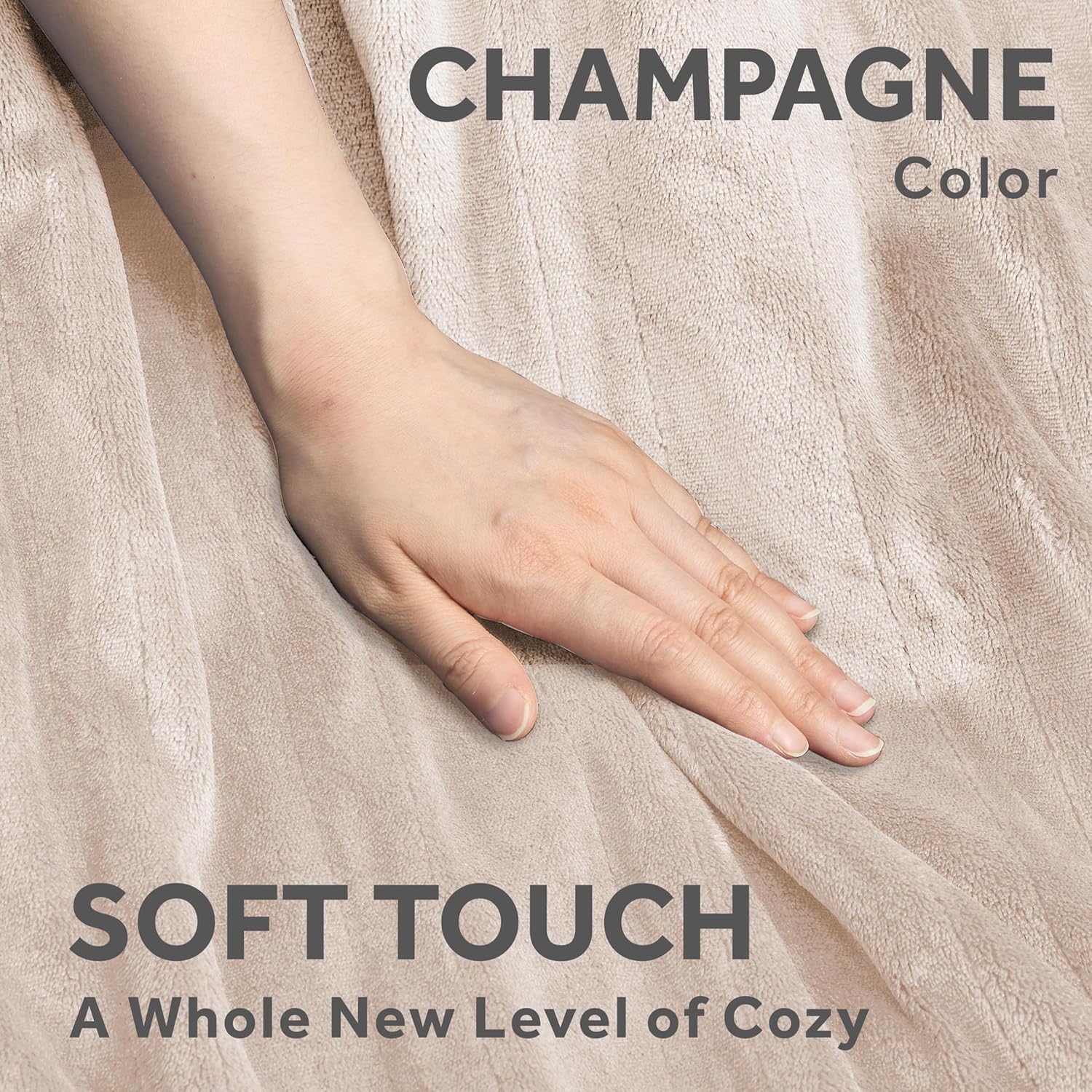 A hand gently touching the soft Champagne-colored Royal Posh Velvet fabric, highlighting its luxurious feel.