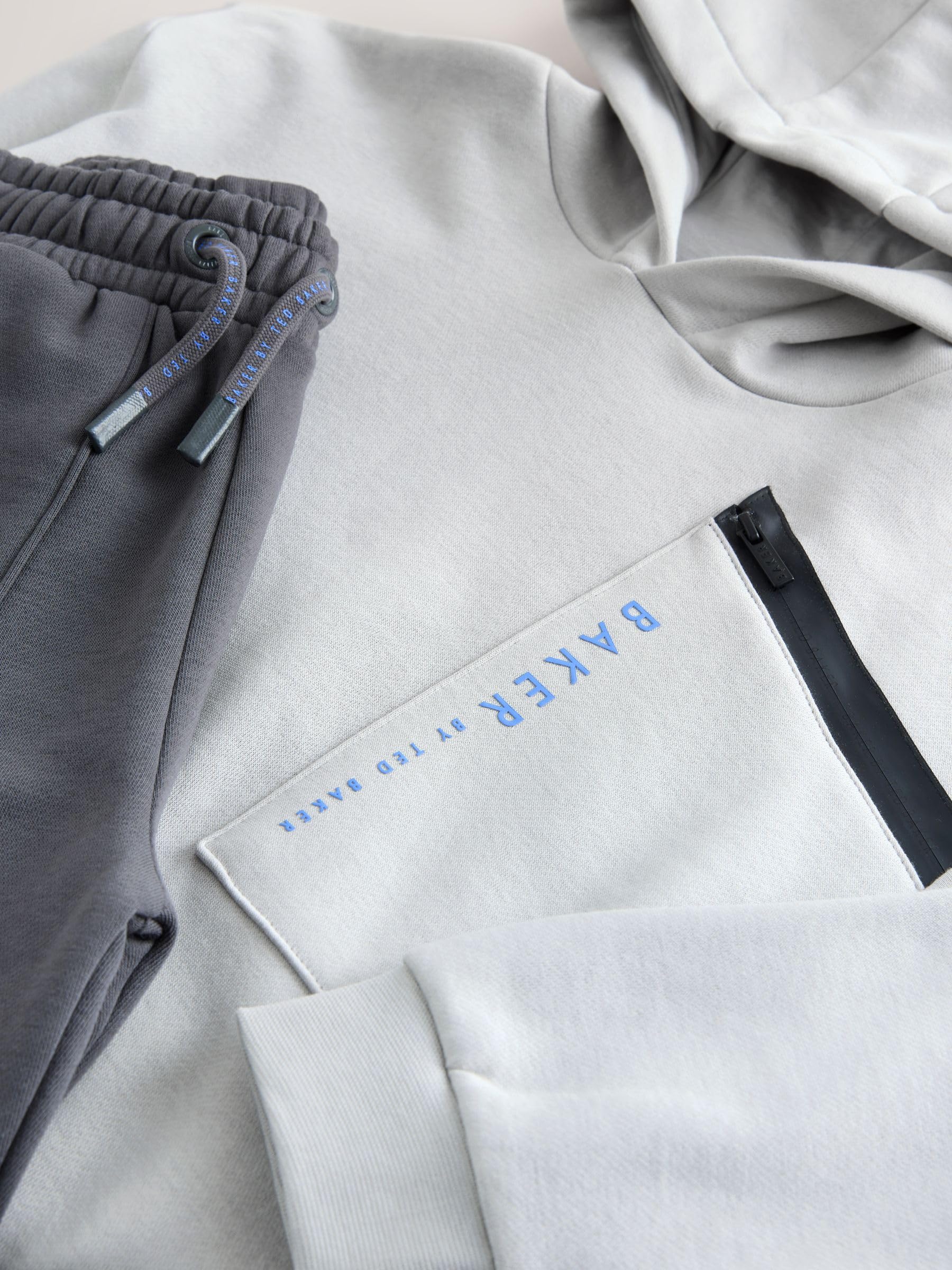 Niños Conjunto de sudadera extragrande con capucha y pantalones de chándal con bolsillo y cremallera
