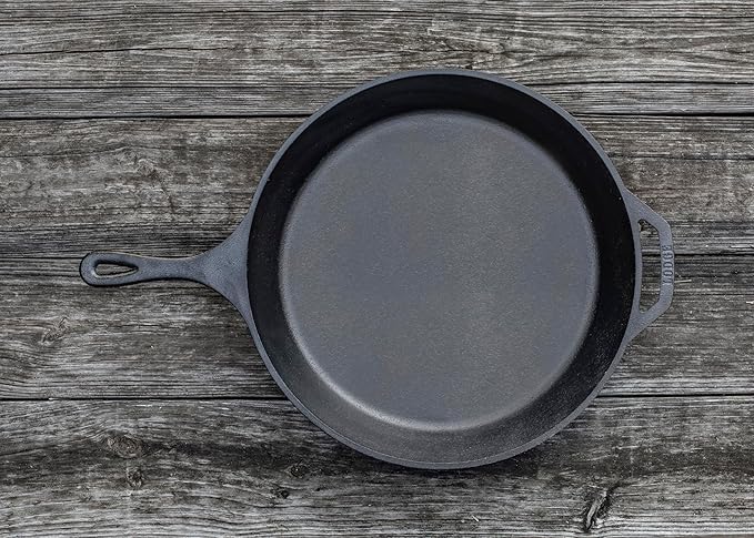 The Lodge L14SK3 15-Inch Logic Pre-Seasoned Cast-Iron Skillet is a versatile and durable kitchen essential, renowned for its exceptional cooking performance and longevity. Made of high-quality cast iron, this skillet is pre-seasoned with 100% natural vegetable oil, providing an easy-release finish that improves with each use. Its large 15-inch size makes it ideal for cooking family-sized meals, from searing and sautéing to baking and frying.