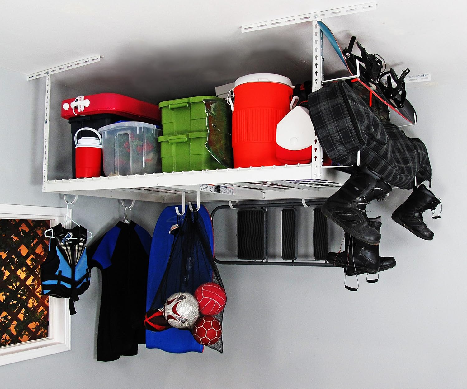 SafeRacks overhead storage rack filled with various storage bins and coolers, demonstrating its capacity and organization.