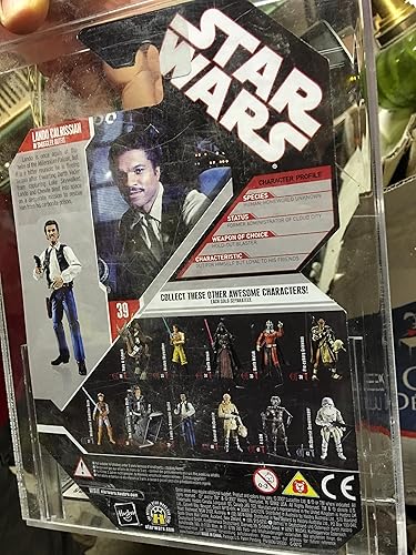 Miniatura 3 de Hasbro Star Wars 30 aniversario LANDO CALRISSIAN IN SMUGGLER DISGUISE Figura de acción con moneda de coleccionista