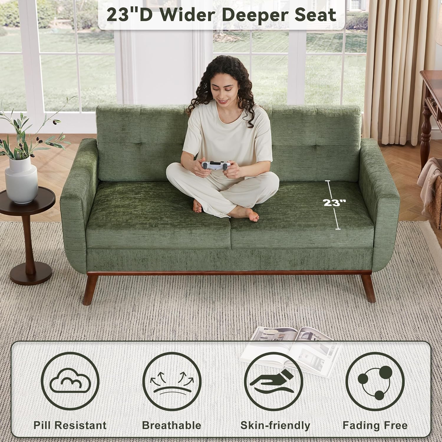 Person sitting on the loveseat, highlighting the 23 inch deep seat and fabric properties