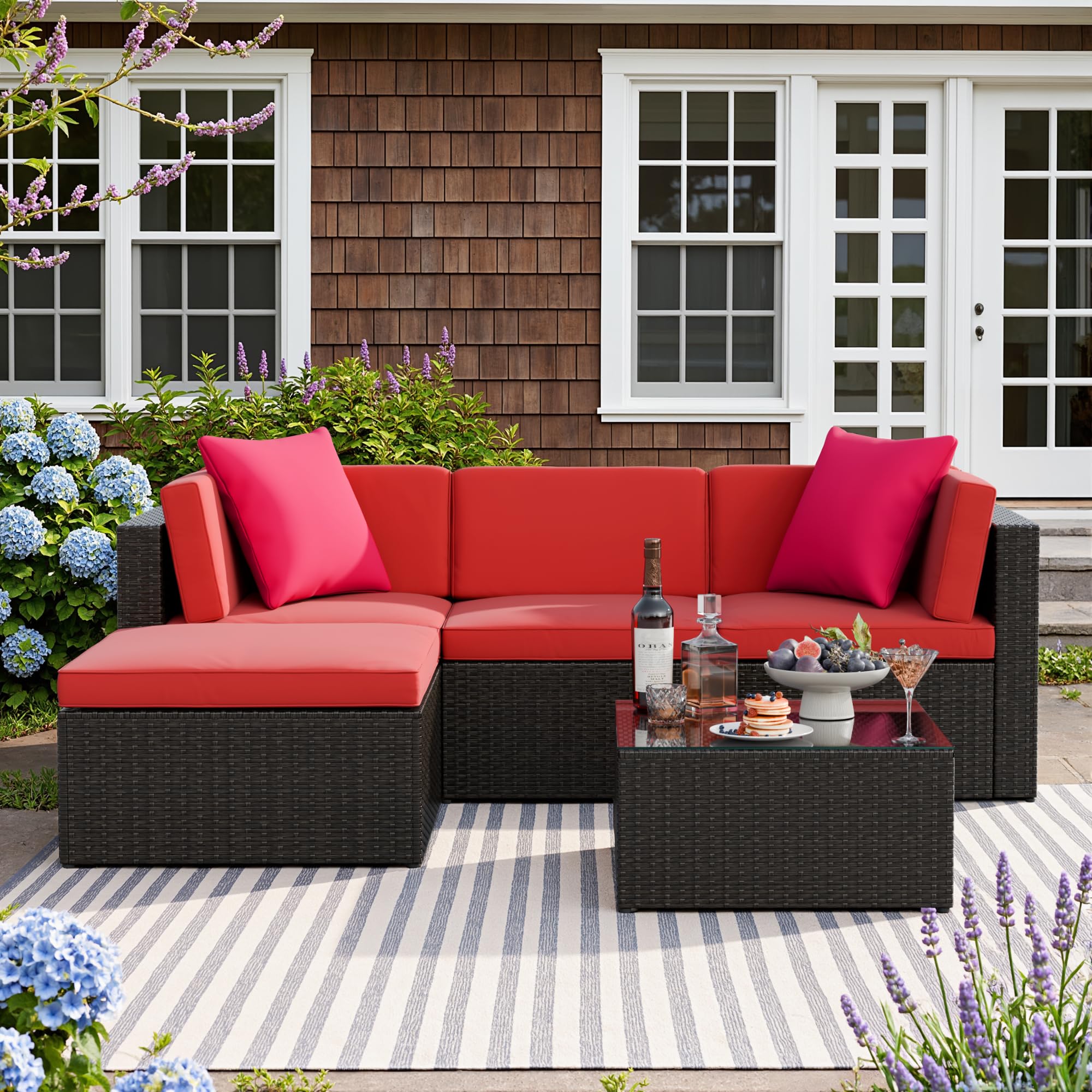 Devoko 5-Piece Patio Furniture Set assembled in an L-shape with red cushions and a glass-top coffee table