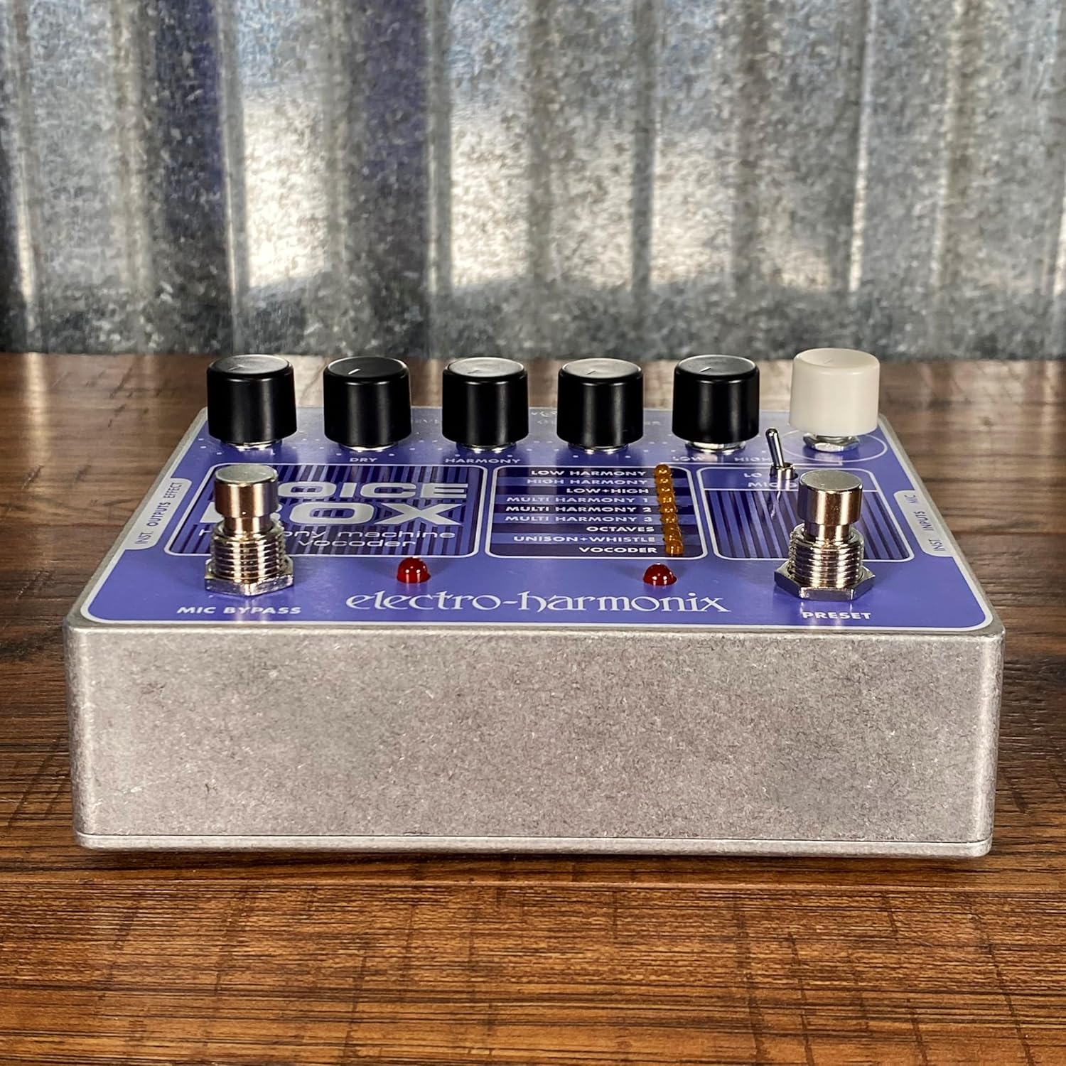 Бурчтуу view of the Electro-Harmonix Voice Box pedal, highlighting the footswitches and side inputs.