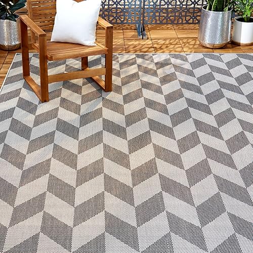 Nicole Miller New York Patio Country Calla - Alfombra contemporánea de espiga para interiores y exteriores, negro/gris, 1 pie y 9 pulgadas x 2 pies