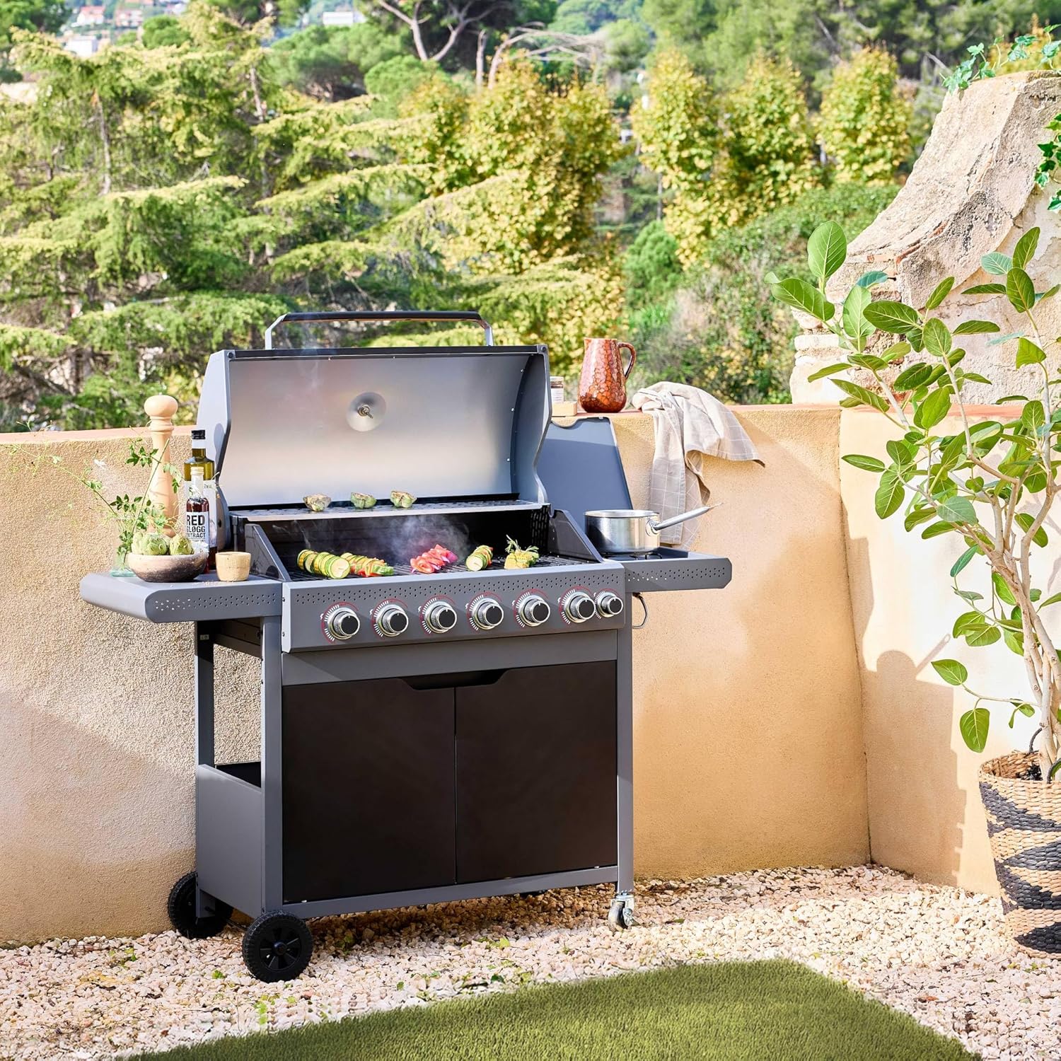 sweeek Edmond Gas Barbecue with lid open, showing food grilling on the grates.