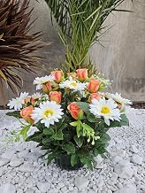 Composition of artificial flowers weighted cement for perfect hold outdoors. Made by us, the flowers are also of very good quality.