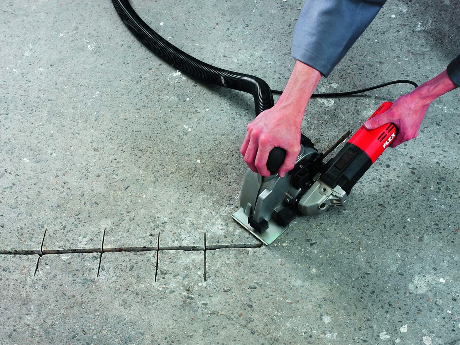 User making multiple parallel cuts on a concrete floor with the FLEX MS 1706FR Wall Chaser