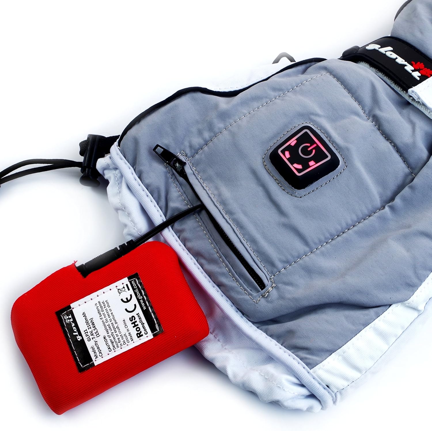 Glovii heated glove with a red battery pack connected and lying outside the glove, illustrating the charging connection.