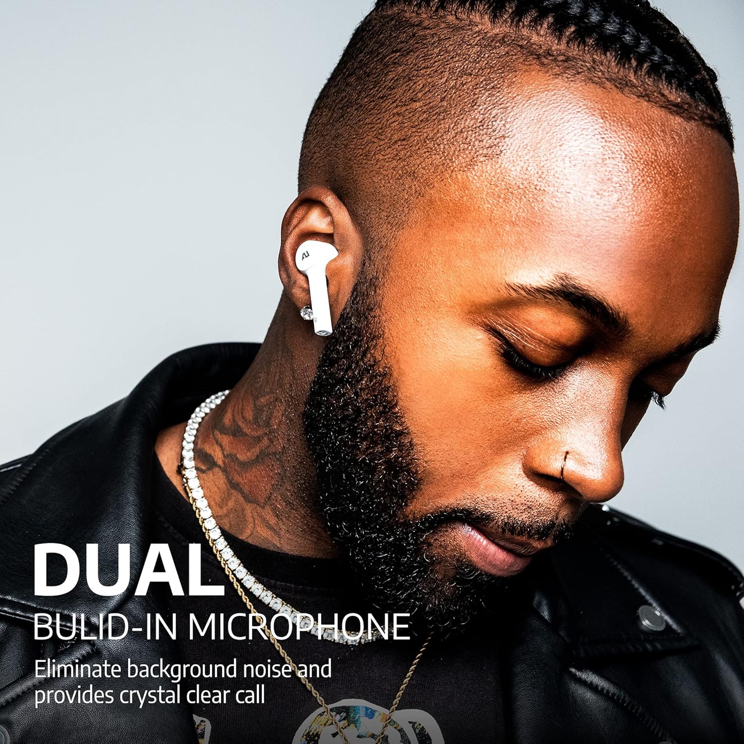 Man wearing white Ausounds AU-Stream earbuds, highlighting the dual microphone feature.
