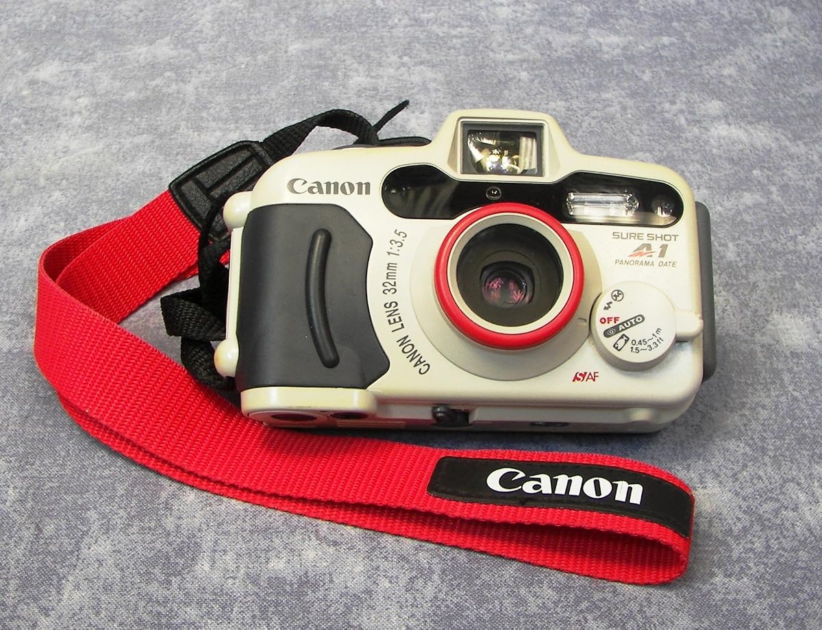 Canon Sure Shot WP-1 / A1 Cámara de película impermeable de 35 mm para apuntar y disparar con lente de enfoque automático Prime de 32 mm F3.5 y flash incorporado (renovado)