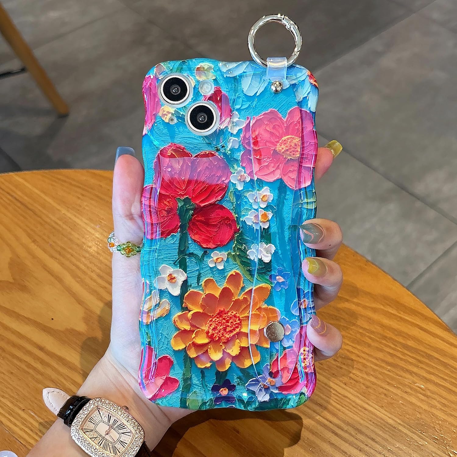 UEEBAI for iPhone 14 Plus/15 Plus Case, Oil Painting Flower Case with Phone Grip Pretty Glossy Wave Cover Cute Floral Curly Cover with Phone Finger Strap Stand for Women Girl, Blue Flower