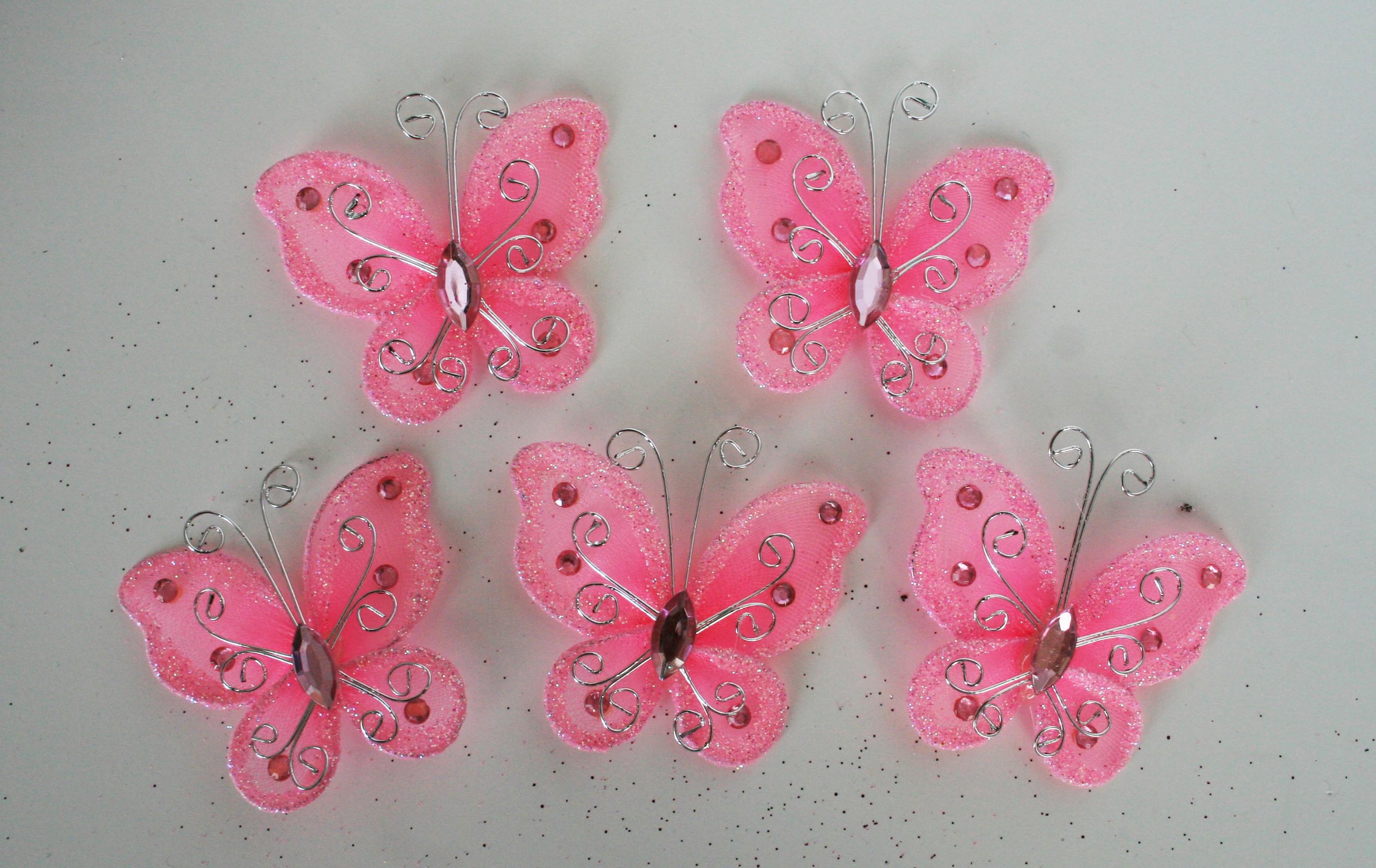 Papillon organza rose vif pour embellir vos boites de dragees de mariage