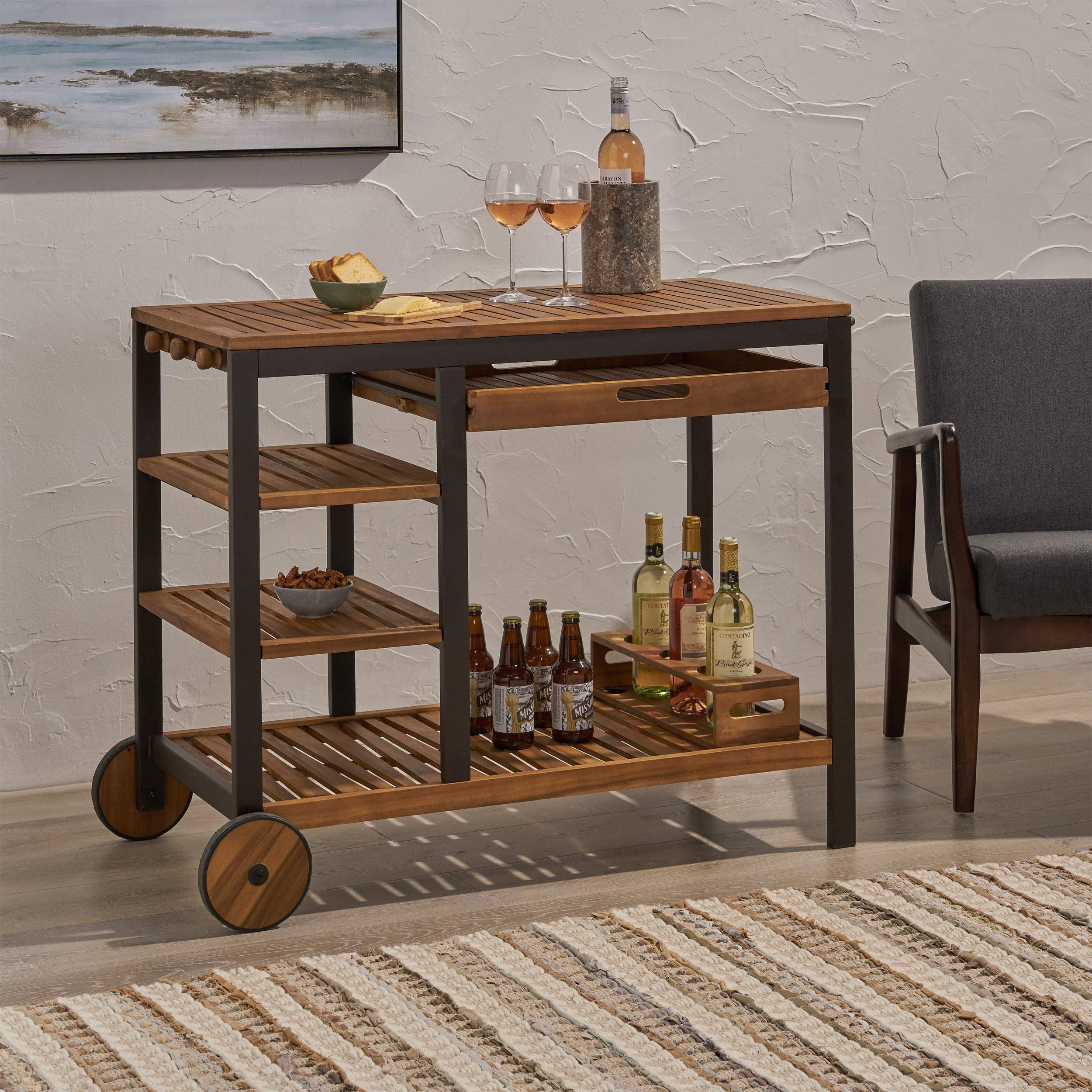 Christopher Knight Home Ishtar Indoor Wood and Iron Bar Cart with Drawers and Wine Bottle Holders, Teak Finish, Rustic Metal