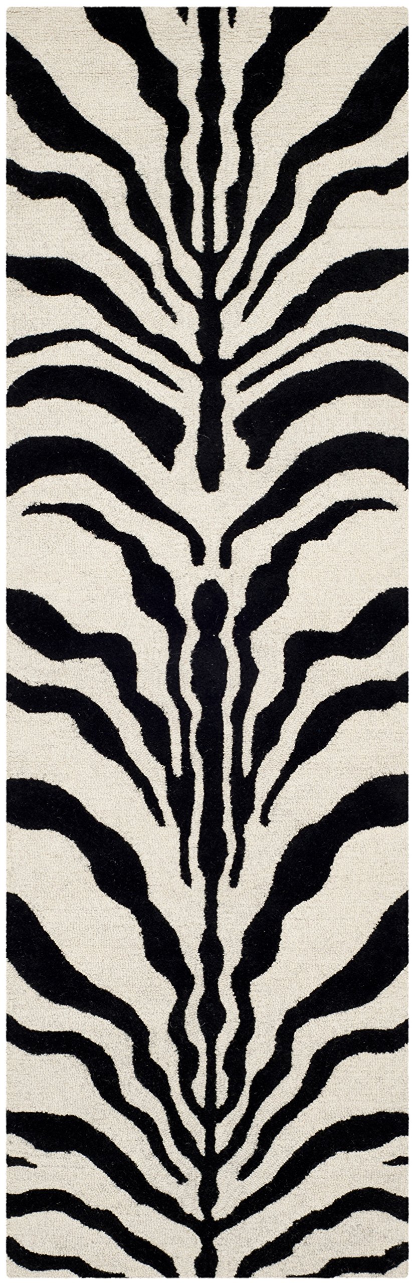 SAFAVIEH Tapis Imprimé Animalier Salon, Salle à manger, Chambre à coucher - Cambridge Collection, Tapis à poil court, Ivoire et noir, 76 X 244 cm