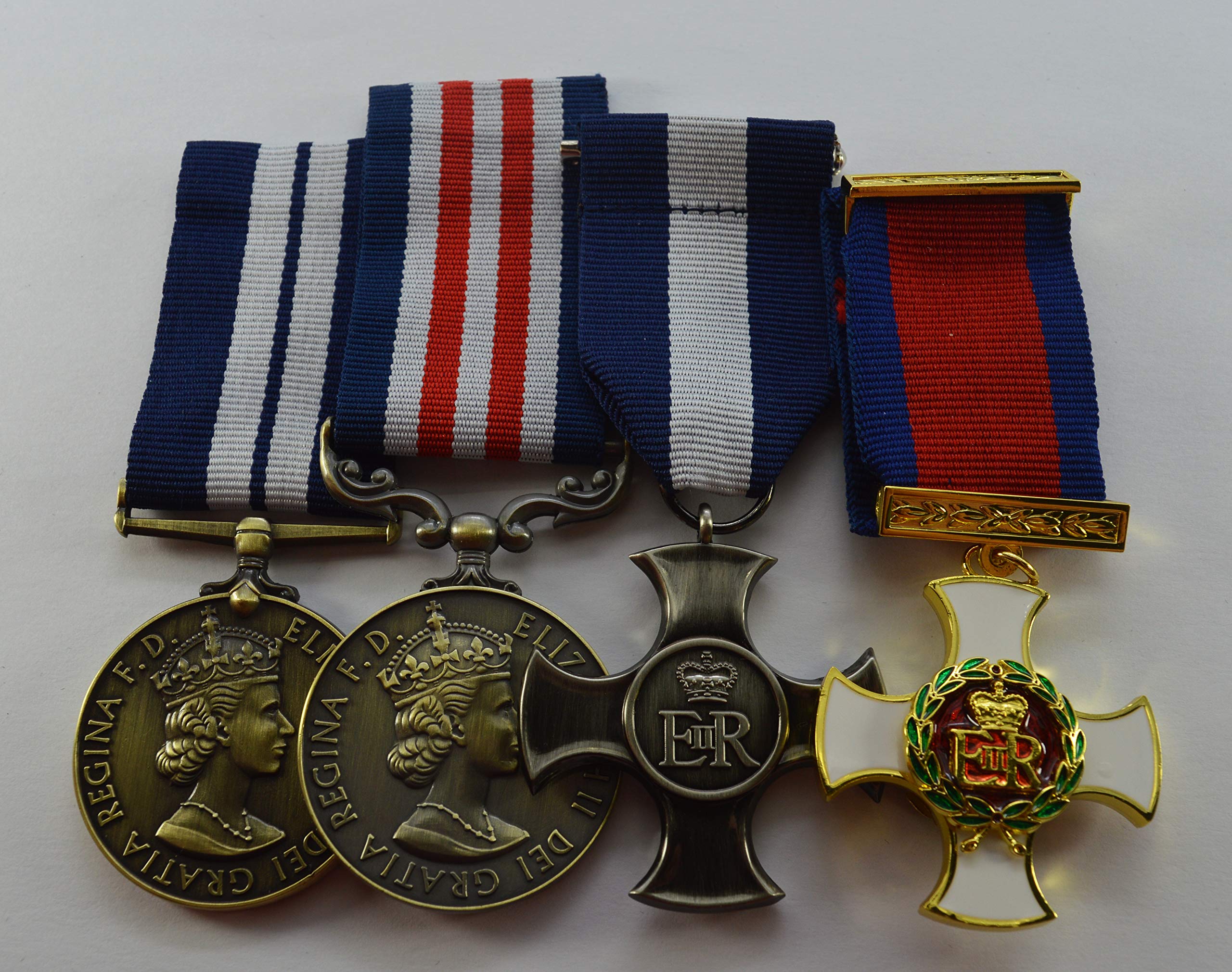 Four Elizabeth II Military/Naval Medals for Distinguished Service and Bravery in the Field. DSM DSO ER-II Distinguished Service Cross. Navy