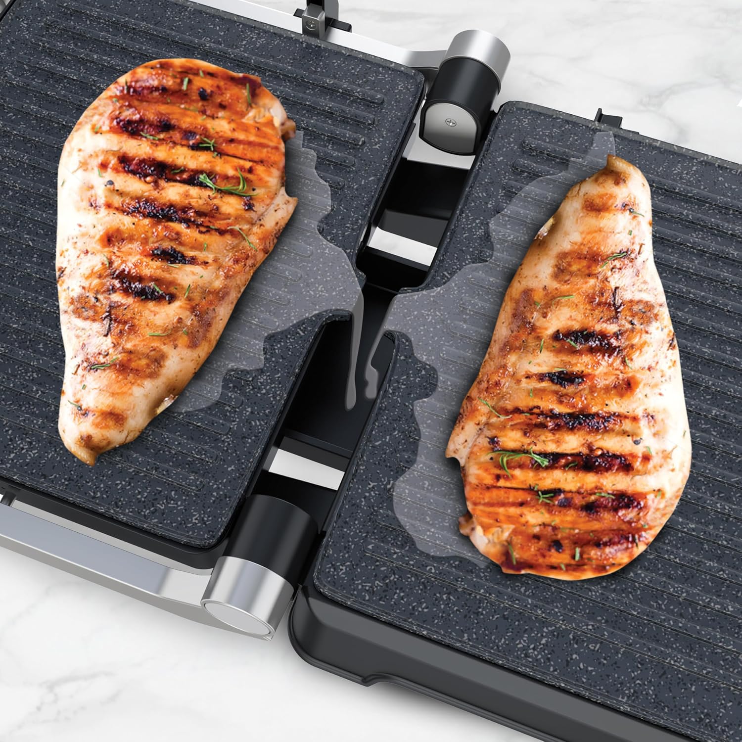 Close-up of grilled chicken breasts on the grill plates