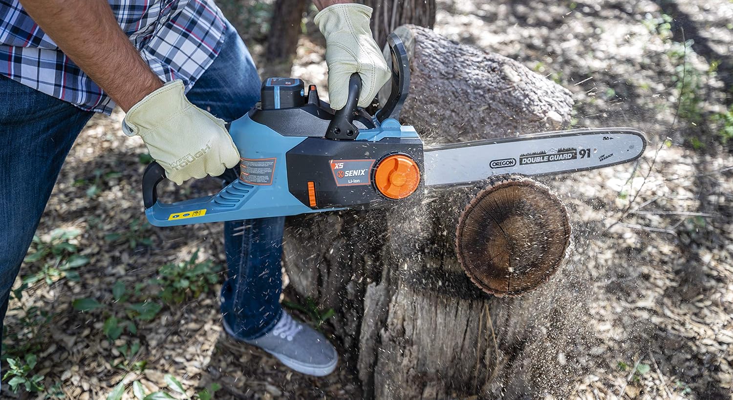 Close-up of the SENIX X5 Chainsaw cutting through a log, showing sawdust.