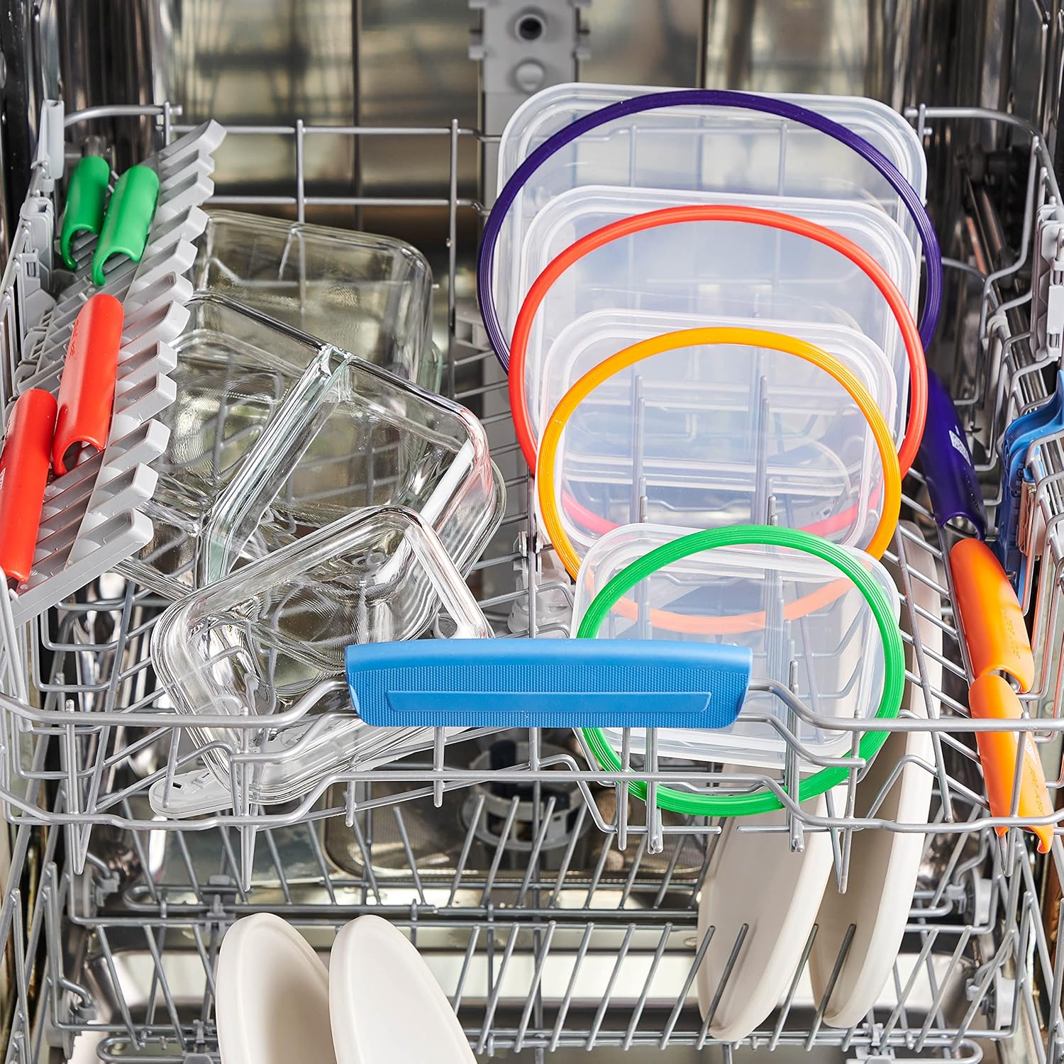 Mastrad Stor'Eat containers and lids placed in a dishwasher rack for cleaning.