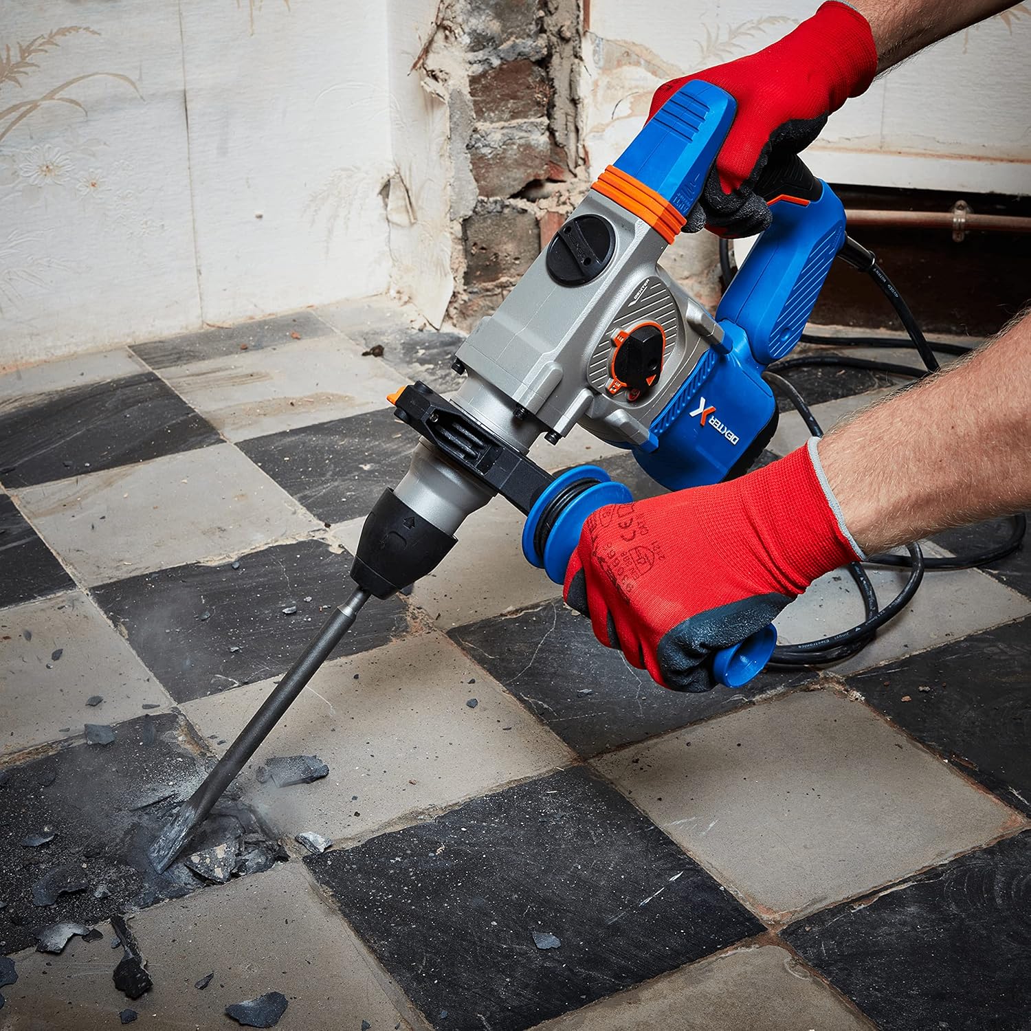 Hammer drill in use, chiseling a floor